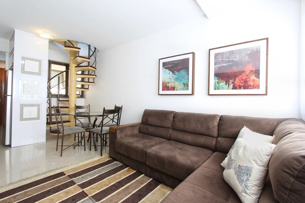 A suite sitting room with a sofa and armchairs